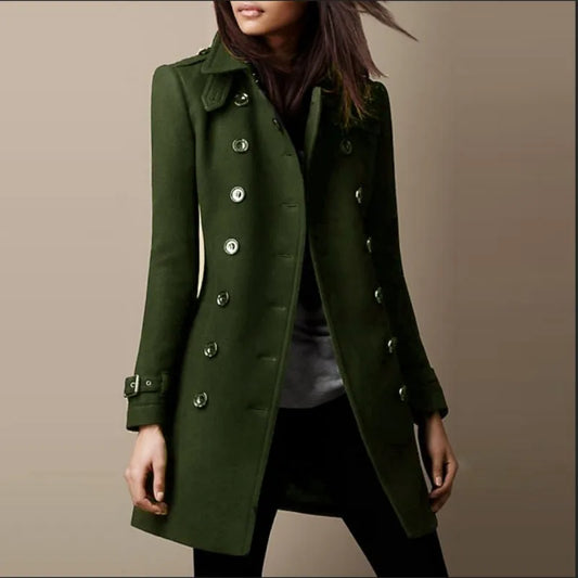 Green coat worn by a person on a beige background