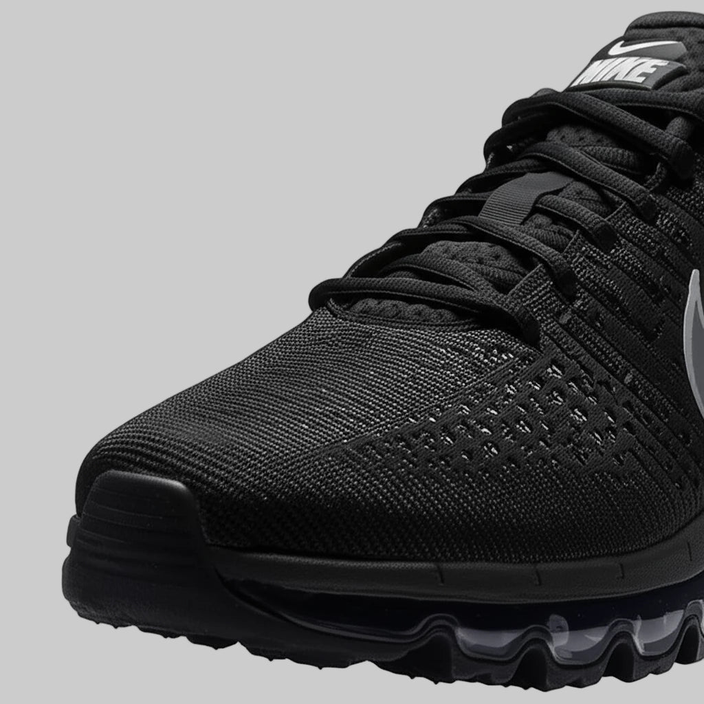 Black Nike Alpha Trainer 6 Air Cushion Shoes with brand logo on a white background