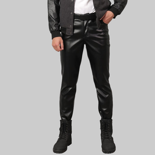 Person wearing Black Leather Pants for Men and black boots on a gray background