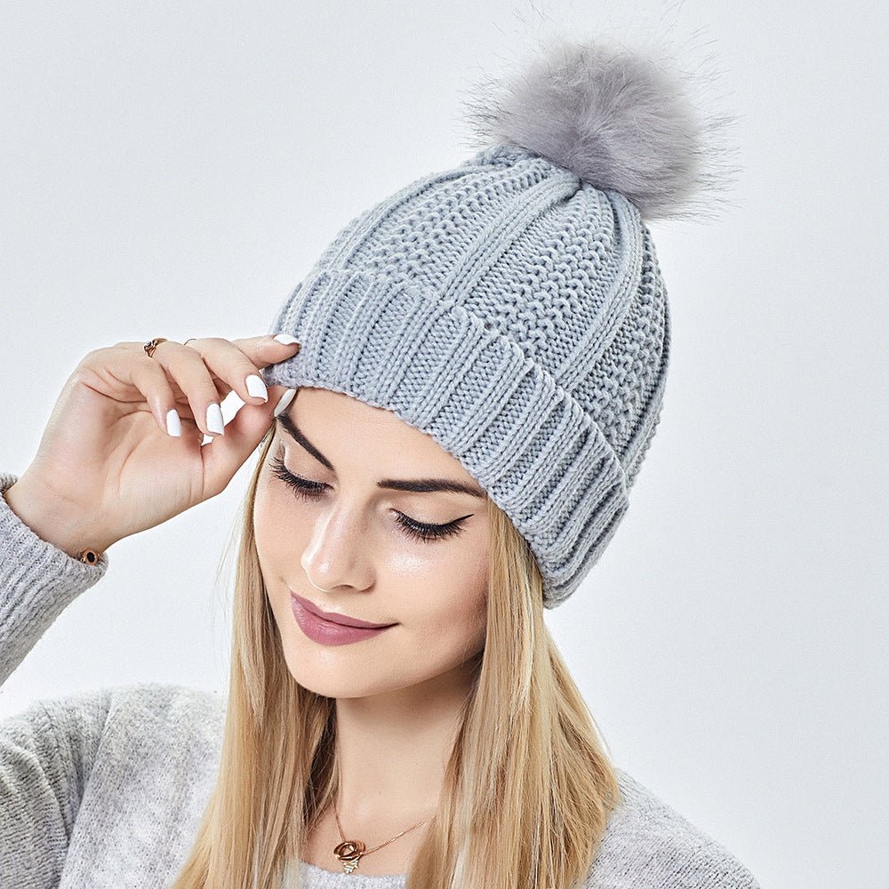 Women's satin-lined knit beanie with faux fur pom – Cozy and stylish winter hat.