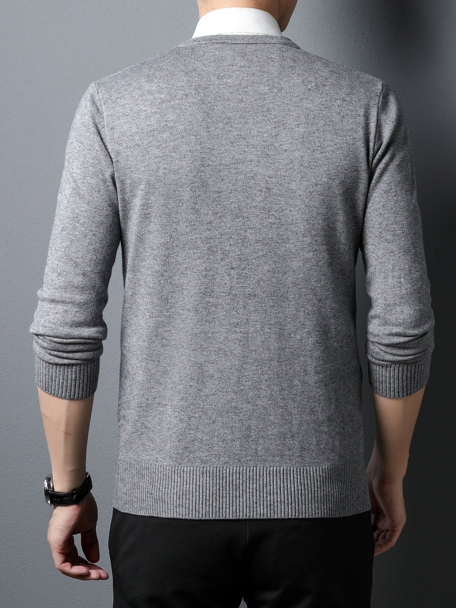 Gray Men's Knitted V-neck Sweater worn by a person on a dark background