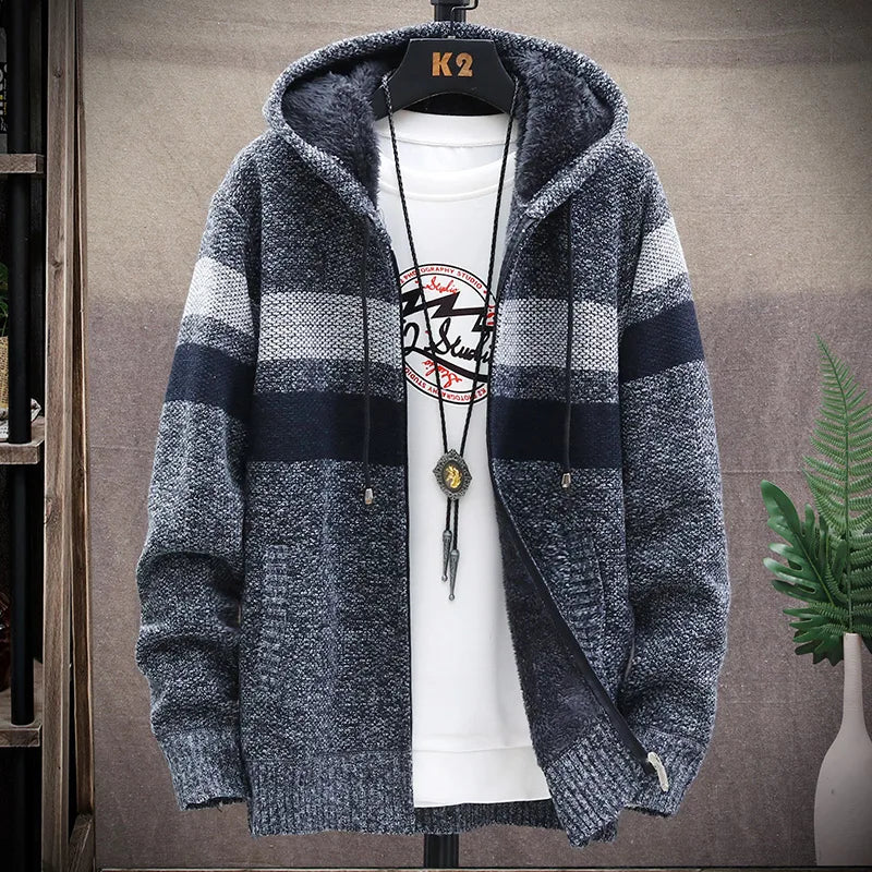 Blue and gray striped hoodie on a mannequin with a white shirt underneath, against a neutral background.