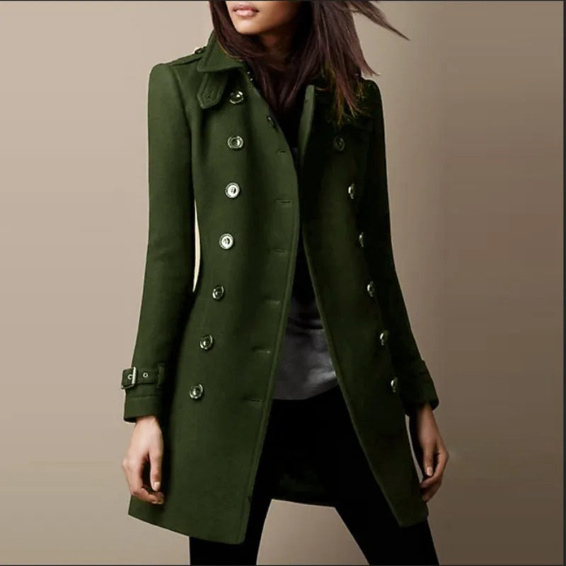 Green coat worn by a person on a beige background