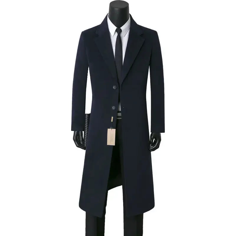 Navy blue overcoat on a mannequin with a white background