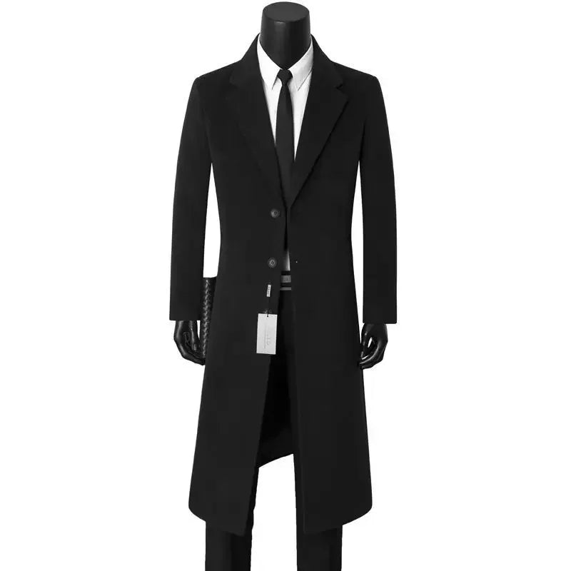 Black coat with a white shirt and tie on a mannequin against a white background