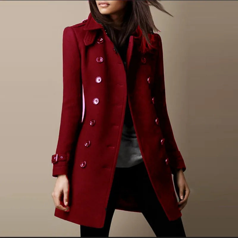 Red coat worn by a person on a beige background