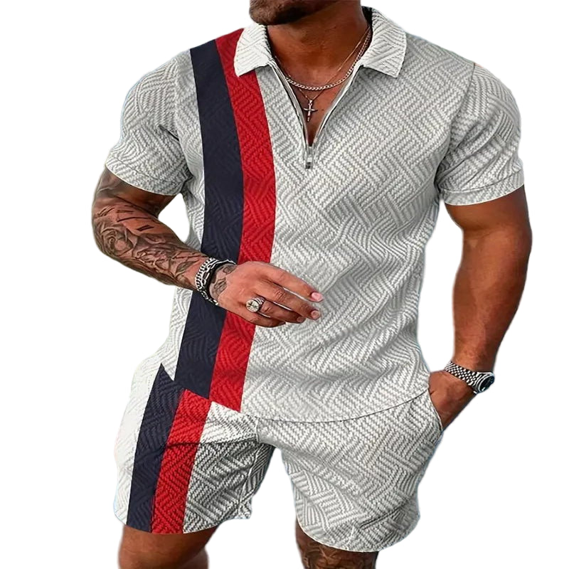 A man wearing a geometric patterned casual beach shorts set with a polo shirt and short-sleeves, standing near a pool.