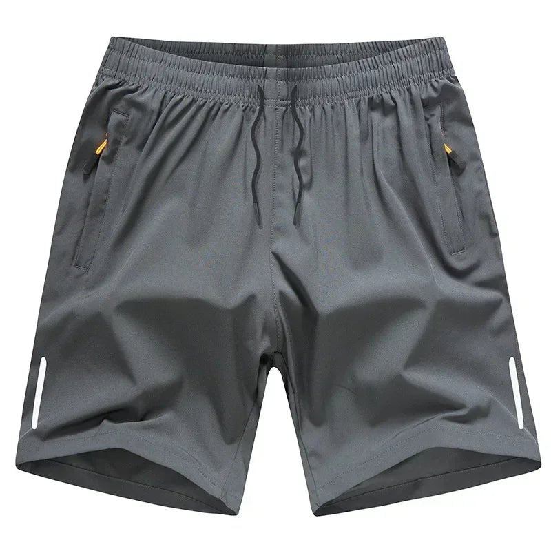 Two pairs of men’s lightweight quick dry shorts in black and grey with zipper pockets and elastic waistband