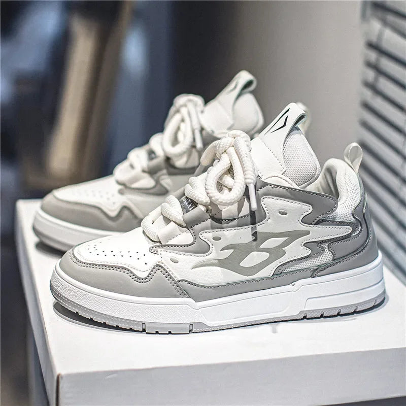 Top view of men’s retro gray and white low-top sneakers