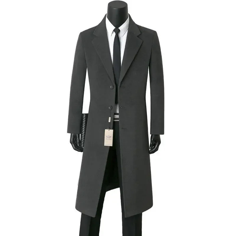 Long dark gray coat on a mannequin with a white background