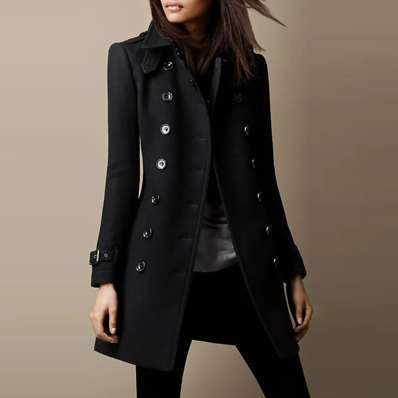Black coat worn by a person on a beige background