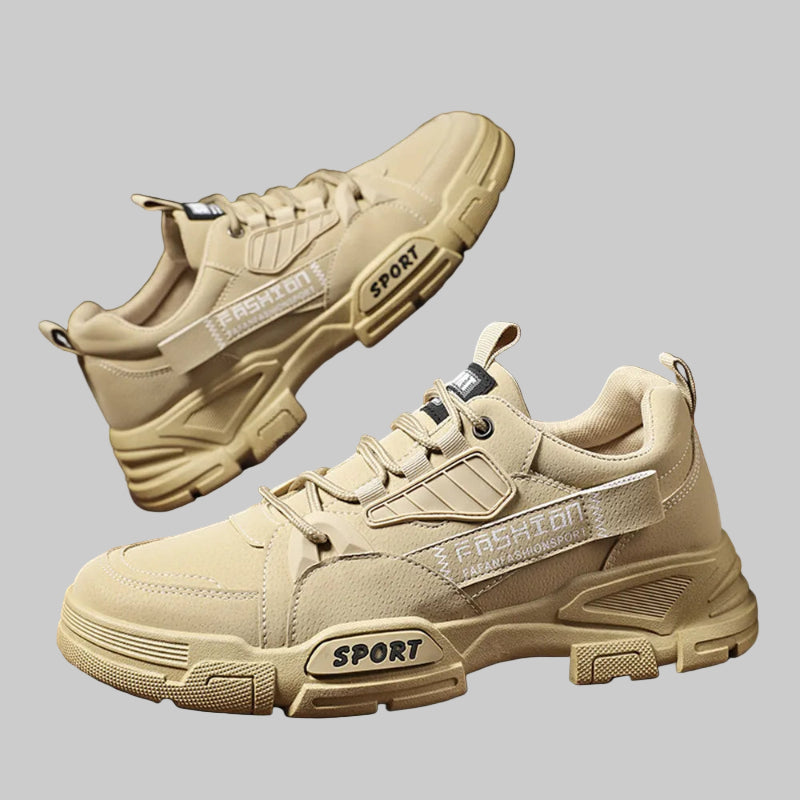 Beige sneakers with 'Sport' label on a dark background