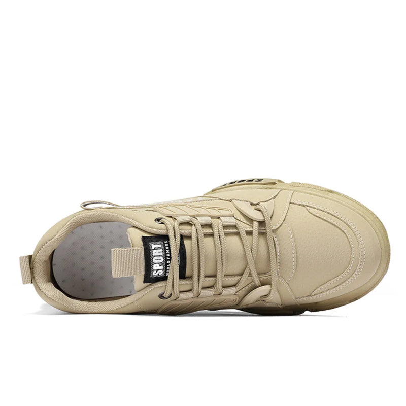 Beige sneaker with a visible brand logo on a white background